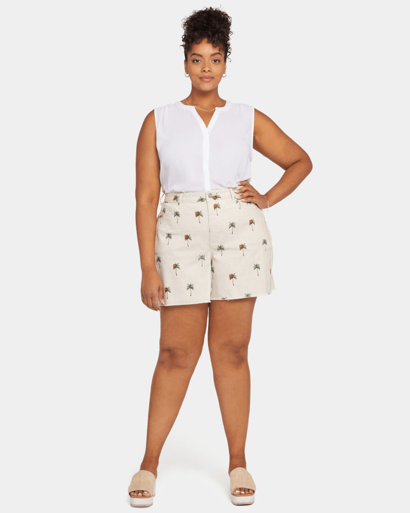 Front of a model wearing a size 14W Brenna Fray Hem Short in Cirque Des Palmes by NYDJ. | dia_product_style_image_id:200306